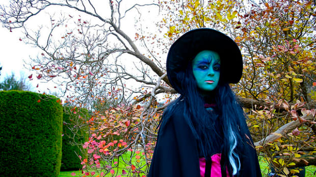 Woman dressed as witch.