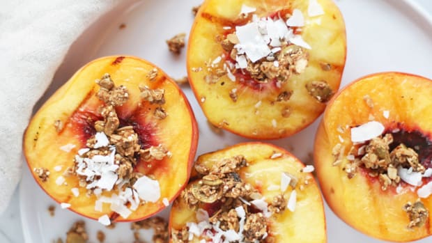 grilled peaches with granola and coconut flakes