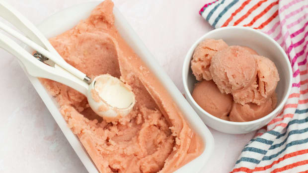 Pink watermelon sorbet or ice cream scooped into bowl