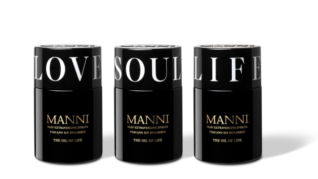 Manni Extra Virgin Olive Oil in black bottles with Love, Soul and Life caps.