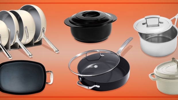 Non toxic cookware pots and pans against an orange background.