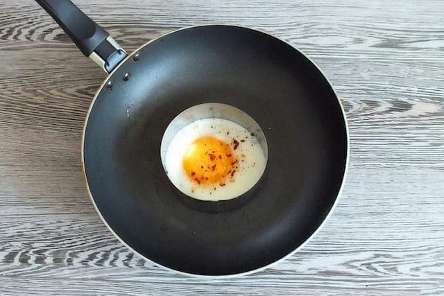 Traditional PTFE nonstick cookware with an egg in it.