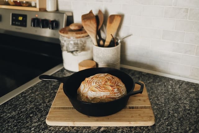 Cast iron pan with loaf of bread.