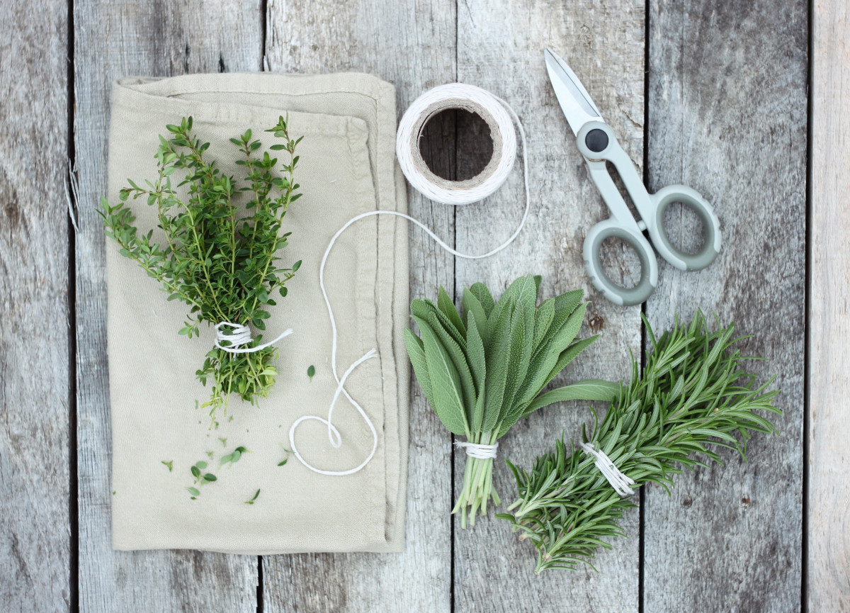 Pictured are thyme, sage, and rosemary.