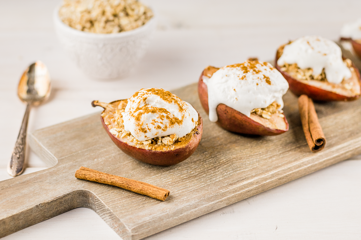 These vegan baked pears with a gluten-free crumble and coconut whipped cream are an elegant and sophisticated dessert fit for autumn and winter gatherings.