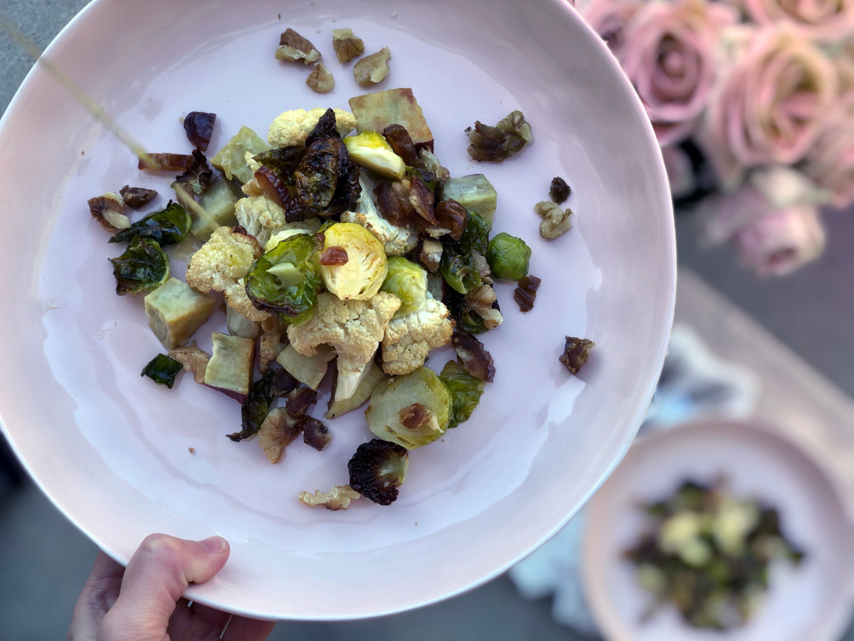 Brussels sprouts, cauliflower, dates on a plate