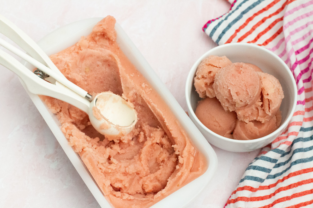 Pink watermelon sorbet or ice cream scooped into bowl