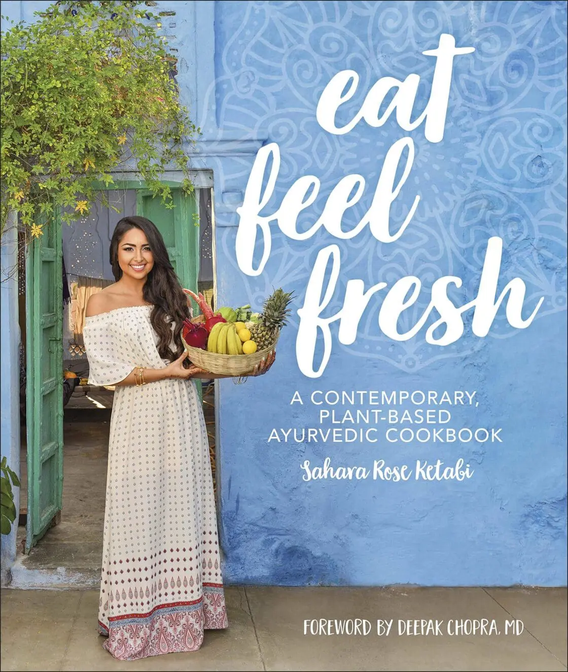 Book cover for "Eat Feel Fresh" by Sahara Rose Ketabi featuring a woman holding fresh produce