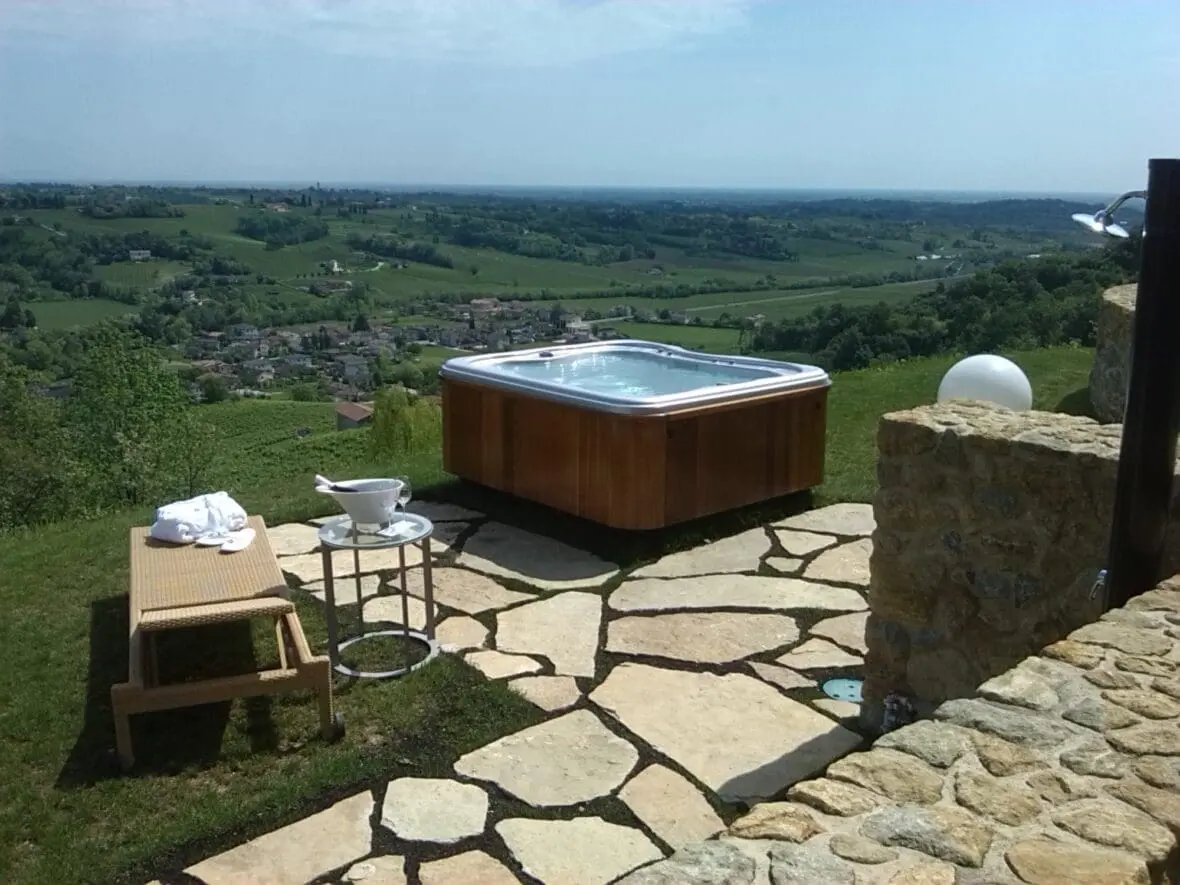 Luxury hot tub on a hilltop terrace overlooking Tuscan countryside