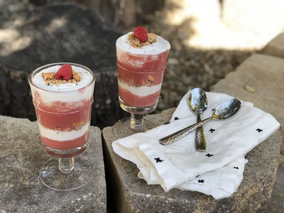 Two glasses of raspberry coconut parfait.