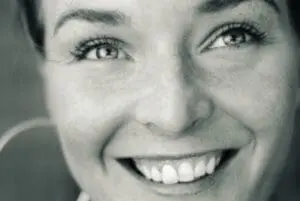 Smiling woman in black and white portrait photograph