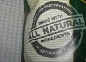 Product label claiming "all natural ingredients" with "no preservatives" and "no artificial flavors