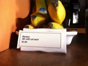 Bananas with price label showing calorie information at a grocery store display