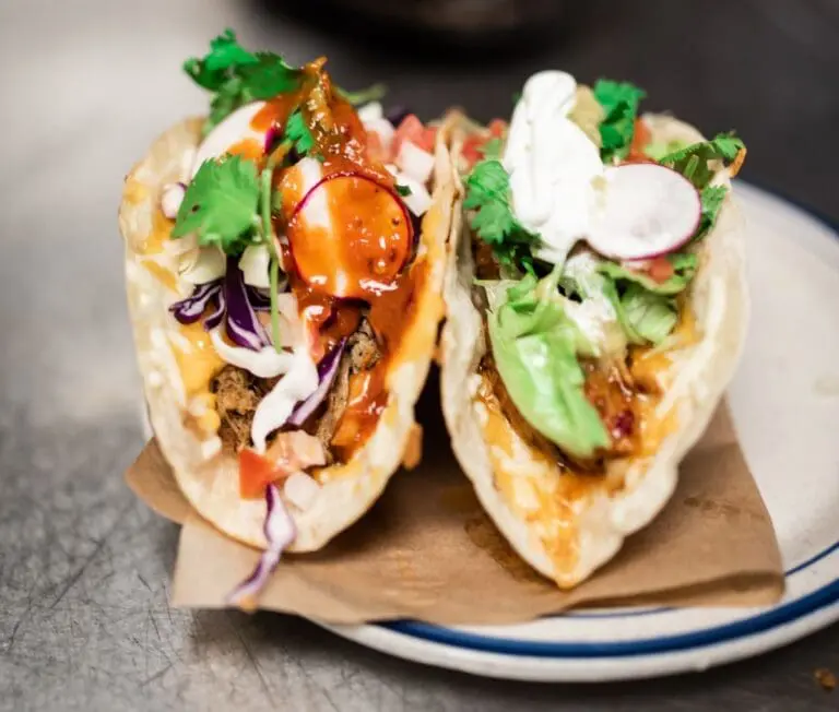 Image of fish tacos with broccoli slaw which contains sulforaphane that is activated when chewed and is a powerful immune system supporter