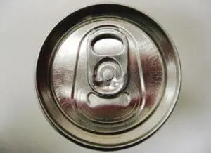 Close-up of a metal beverage can tab and opening