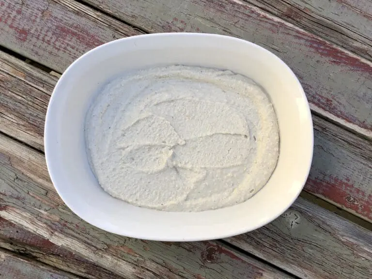 Image of the Healthiest vegan vegetarian 5 layer Black Bean Layer Dip Layer showing step #1 Cashew Cream in a bowl via Organic Authority Black