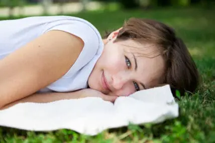 Woman lying on the grass