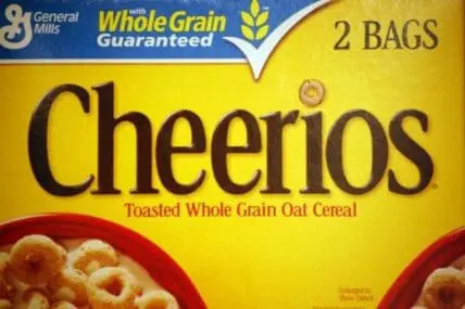 Cheerios cereal box displaying "Whole Grain Guaranteed" label and "2 Bags" packaging