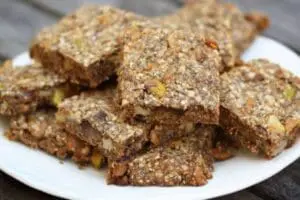 Stacked chia seed brownies on a white plate
