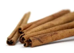Cinnamon sticks arranged on a white background