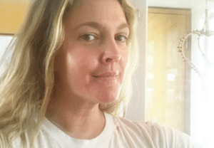 Drew Barrymore with minimal makeup in a casual selfie
