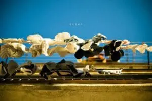 Clothes hanging on a line to air dry against a blue sky