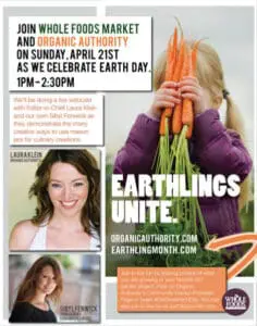 Child holding fresh carrots and green onions at Whole Foods Market Earth Day event