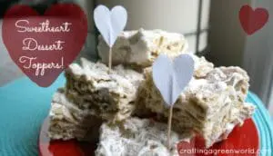 Sweetheart dessert bars with heart-shaped toppers on a turquoise plate
