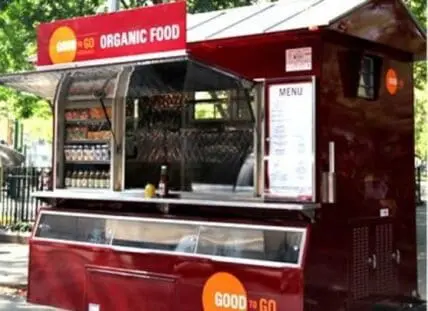Good to Go organic food truck with red exterior and menu board