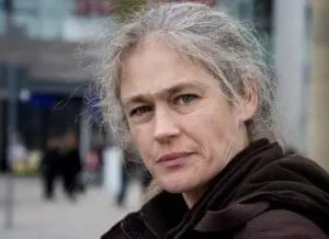 Woman with gray hair in outdoor urban setting