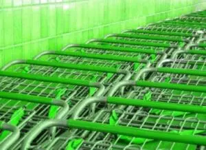 Bright green shopping carts lined up in a row