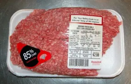 Package of ground beef labeled 85% lean with nutrition facts and food safety label