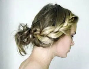 Woman with braided updo hairstyle shown in profile view