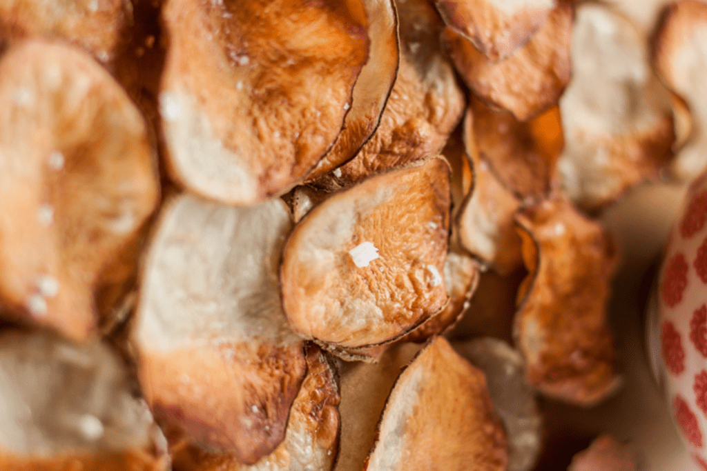 Image of up close shot of very crispy and browned homemade baked potato chips that are actually healthy.
