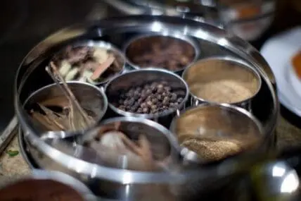 Spice carousel with various dried herbs and spices in small compartments
