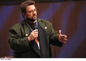 Silent Bob speaking at a conference with microphone