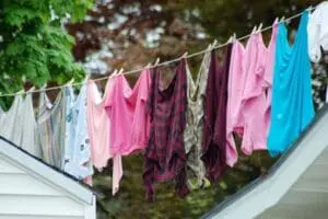 Colorful clothes hanging on a clothesline to dry outdoors