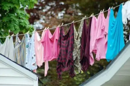 Colorful clothes hanging on a clothesline to dry outdoors