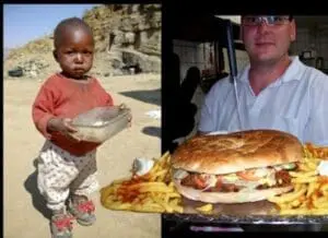 Child in poverty holding empty bowl beside man eating large burger and fries