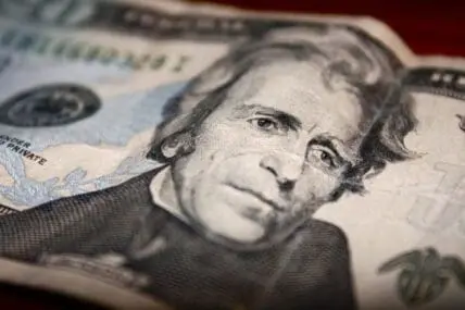 Close-up of a $10 bill showing Alexander Hamilton's portrait