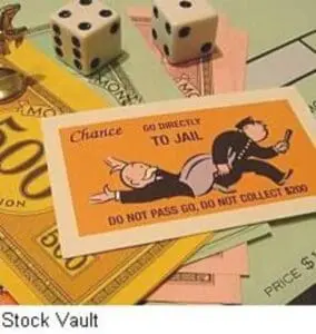 Monopoly "Go to Jail" card with dice and game board