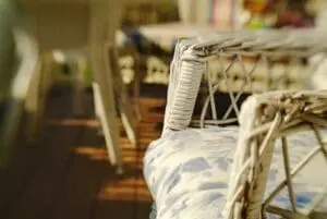 Wicker chair on porch.