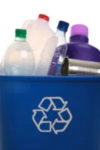 Blue recycling bin filled with plastic bottles and metal cans