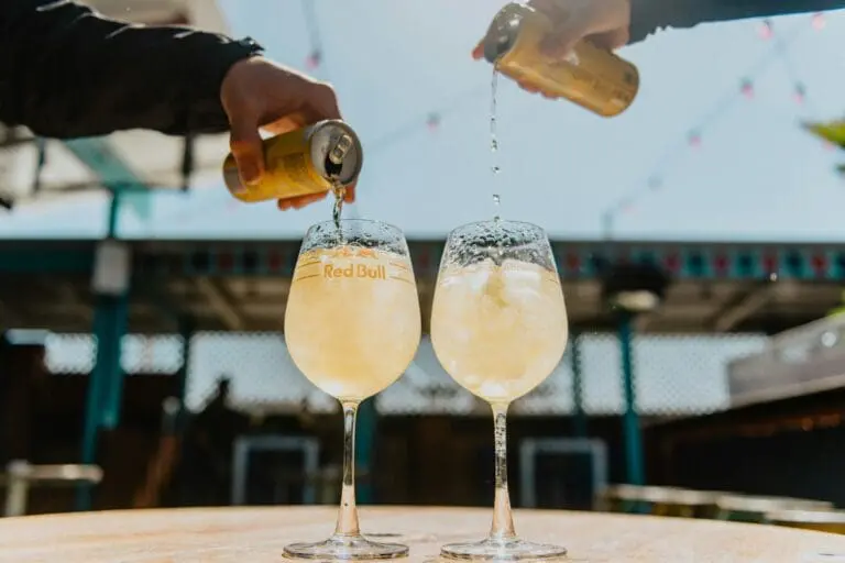 Image of two Red Bulls being poured into a two glasses with ice. Okay, it looks fancy but are the ingredients safe?