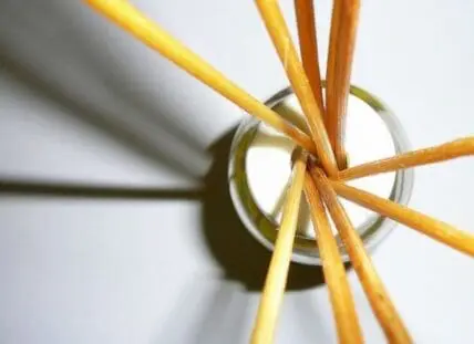 Wooden skewers tied with twine inserted into a glass jar for DIY essential oil diffuser