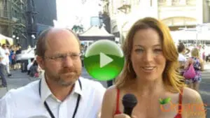 Russ Parsons and a female interviewer at an outdoor event holding a microphone