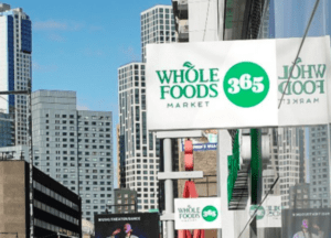 Whole Foods Market 365 storefront signage on urban building exterior
