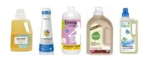 Five bottles of natural laundry detergent products lined up in a row