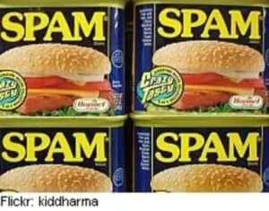 Four cans of SPAM processed meat with sandwich imagery on labels