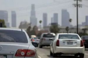 Los Angeles traffic and skyline with vehicles on highway